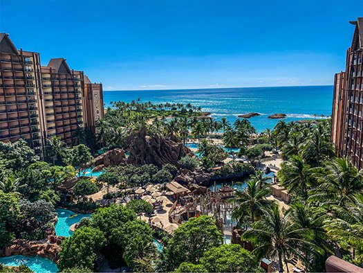 Aulani, A Disney Resort & Spa view featuring lush tropical landscaping, pools, and ocean backdrop, ideal for family vacations and travel planning.